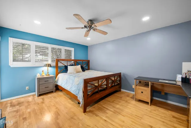 a bedroom with a bed and a tv