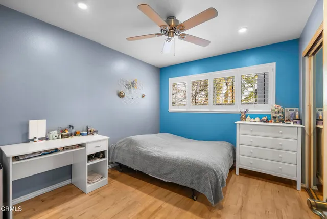 a bathroom with a sink vanity mirror and toilet