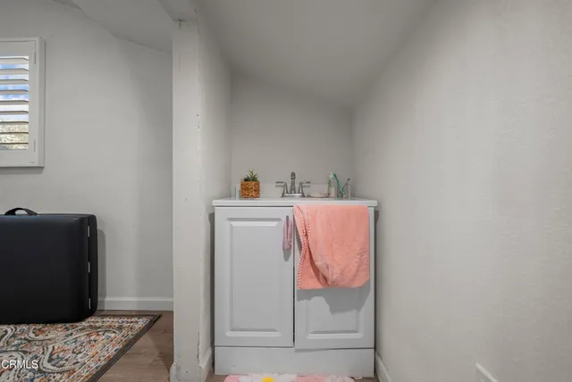 a bedroom with a bed and cabinets