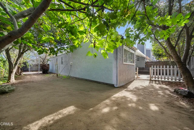 a view of a bench in the backyard
