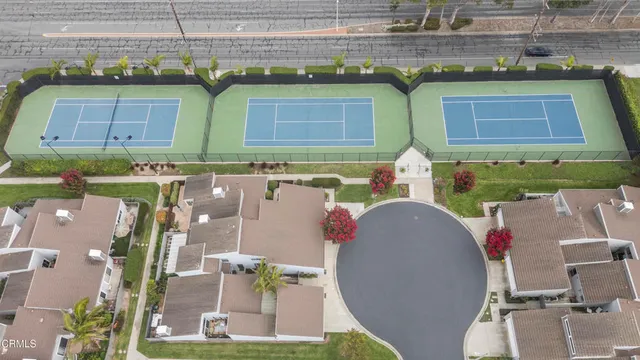 an aerial view of residential houses with outdoor space