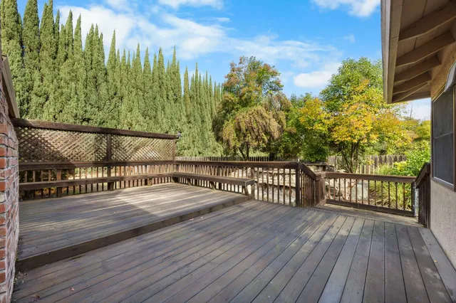 a view of a balcony with wooden floor