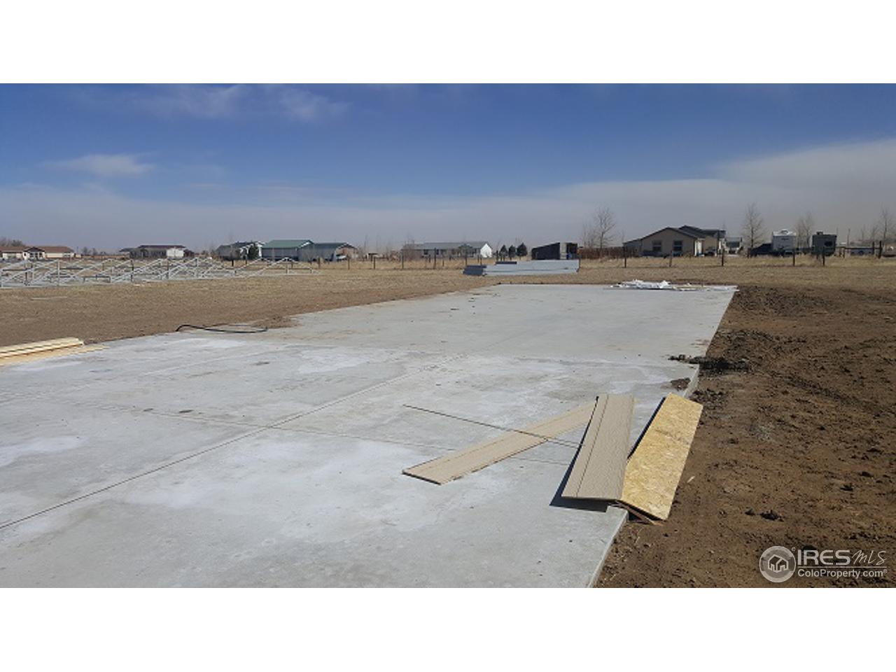 40 East Ranch Road Wiggins, CO 80654 - Photo 11 of 11 Garage Pad
