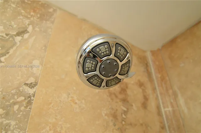 a bathroom with a light fixture and a window