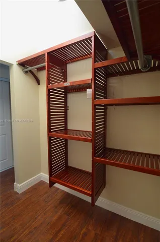 a view of a door and wooden floor