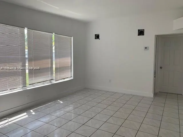 a view of an empty room with window