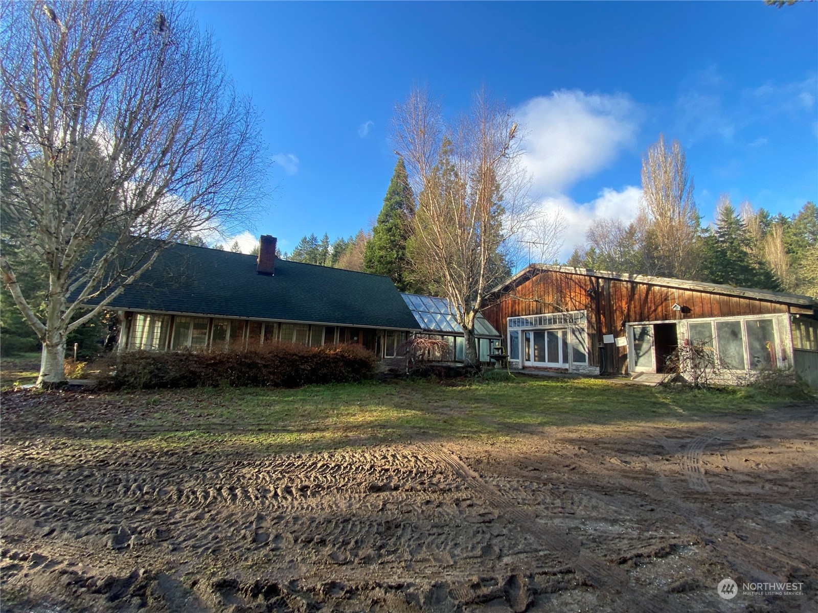 12625 Southwest Cemetery Road Vashon, WA 98070 - Photo 1 of 1 a front view of a house with a yard