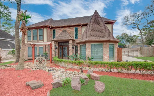 a front view of a house with garden
