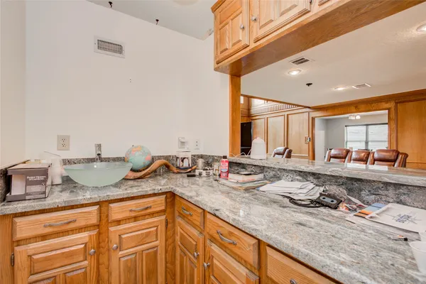a kitchen with sink and window