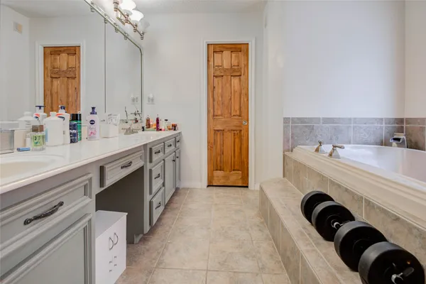 a bathroom with a sink double vanity and a mirror