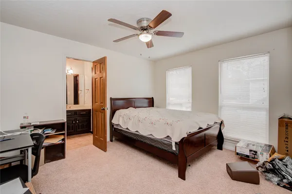 a bathroom with a sink a toilet a shower and a mirror