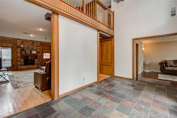 a view of a hallway with living room
