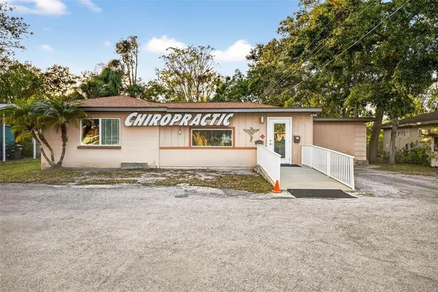 a view of house with a yard