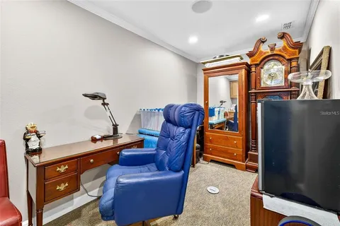 a kitchen with stainless steel appliances granite countertop a sink cabinets and wooden floor