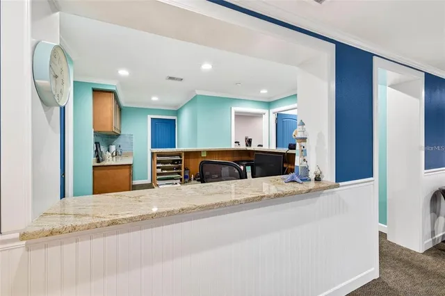a view of a kitchen from the dinning room