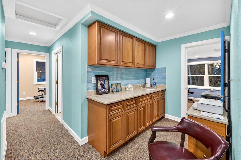 12574 Indian Rocks Road Largo, FL 33774 - Photo 9 of 32 a kitchen with stainless steel appliances granite countertop a sink and cabinets