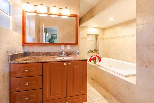 a bathroom with a bathtub and shower