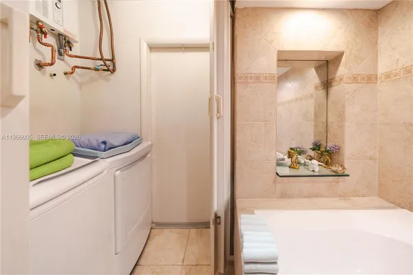 a kitchen with stainless steel appliances a refrigerator sink and cabinets
