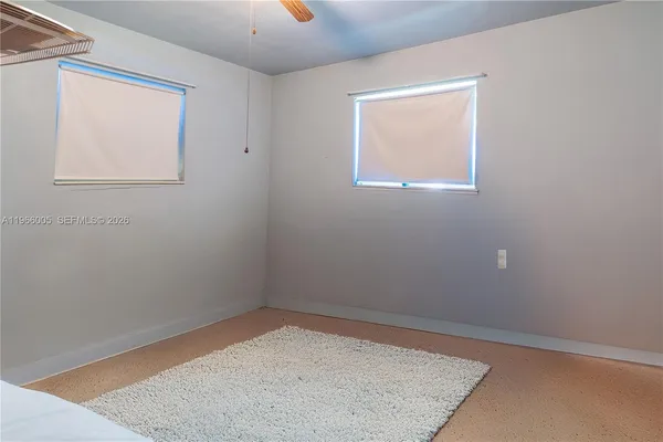 a bedroom with a bed and a chair