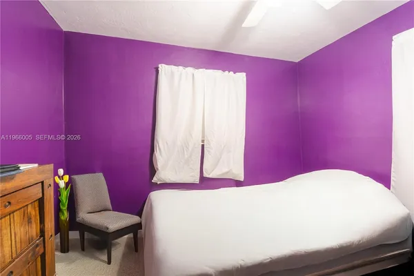 a bathroom with a sink a toilet and a window