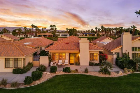 a view of a chairs and table on the terrace