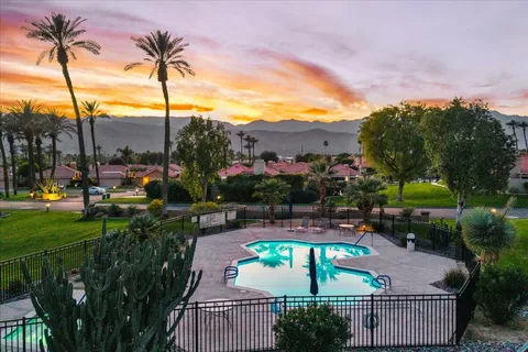 a view of a patio with swimming pool
