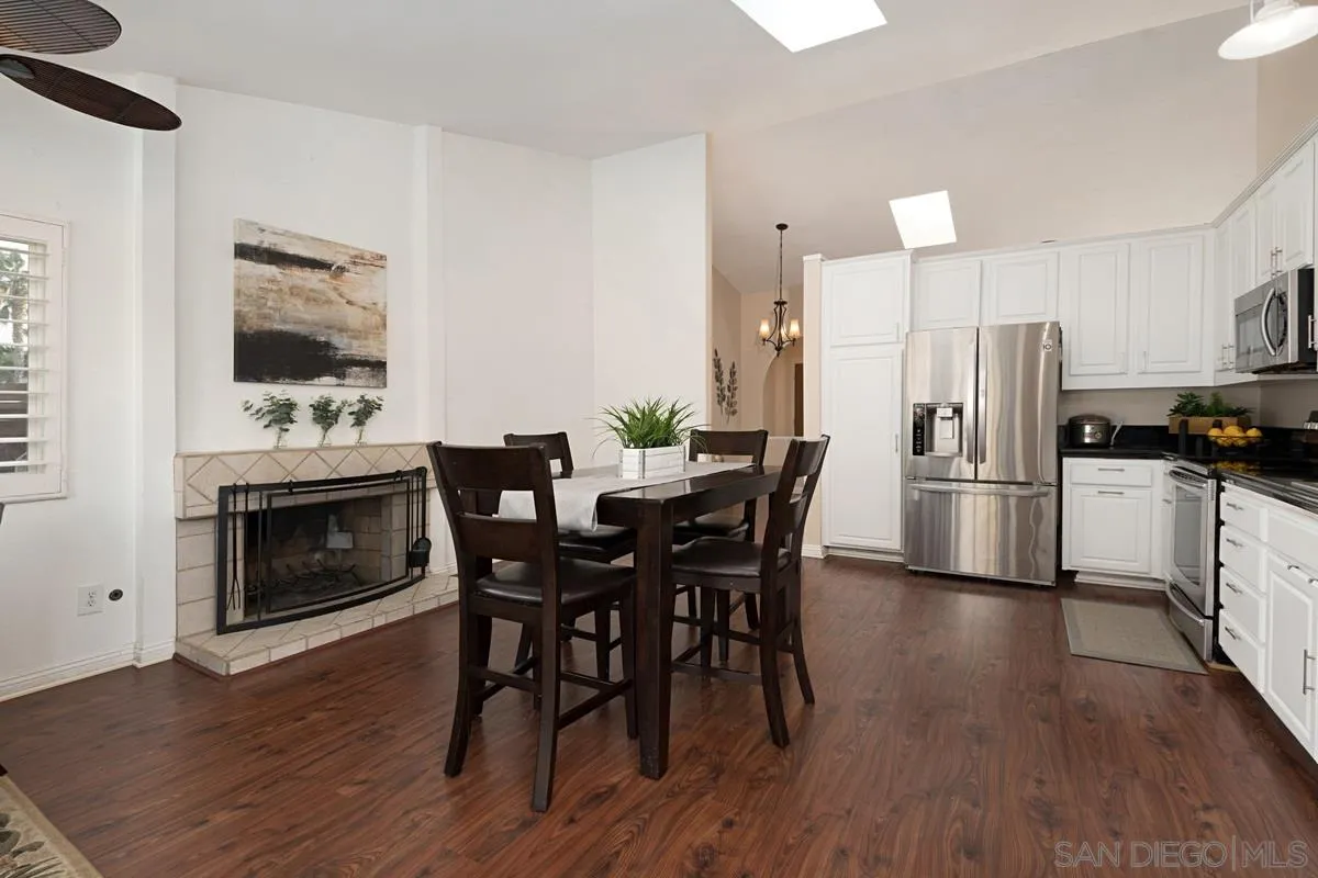11068 Pinzon Way San Diego, CA 92127 - Photo 13 of 31 a view of a dining room with furniture and wooden floor
