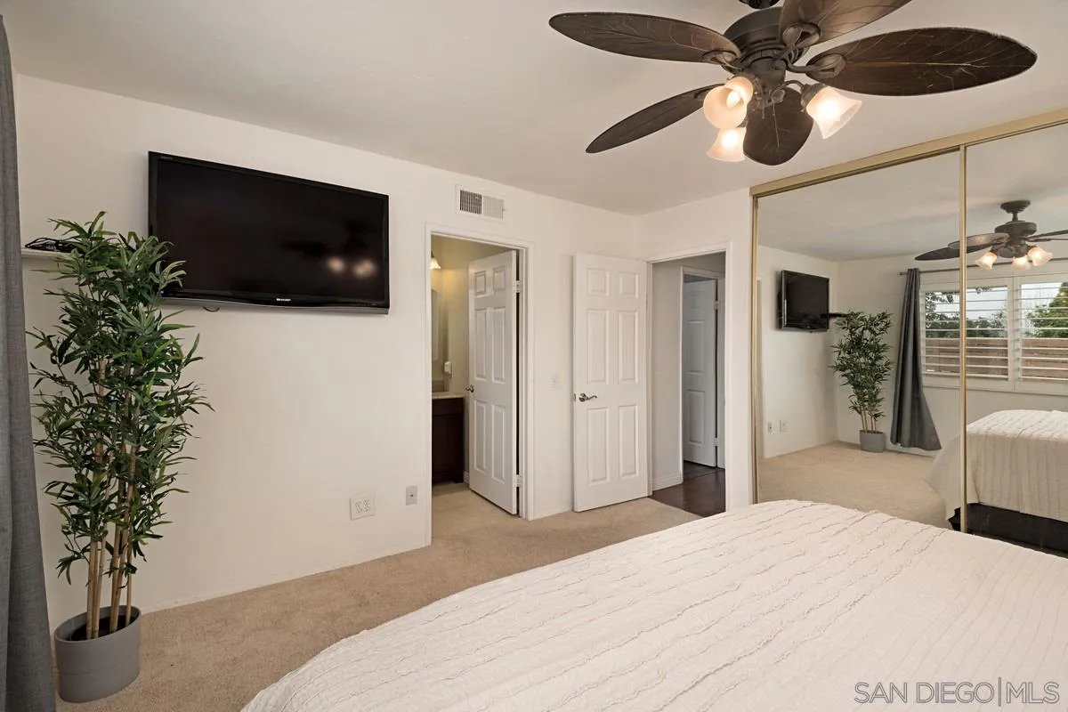 11068 Pinzon Way San Diego, CA 92127 - Photo 16 of 31 a bedroom with a bed and a television