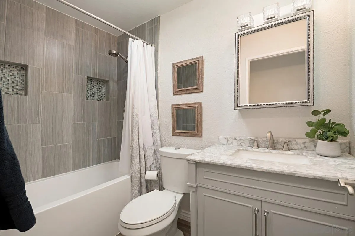 11068 Pinzon Way San Diego, CA 92127 - Photo 20 of 31 a bathroom with a granite countertop sink toilet and shower