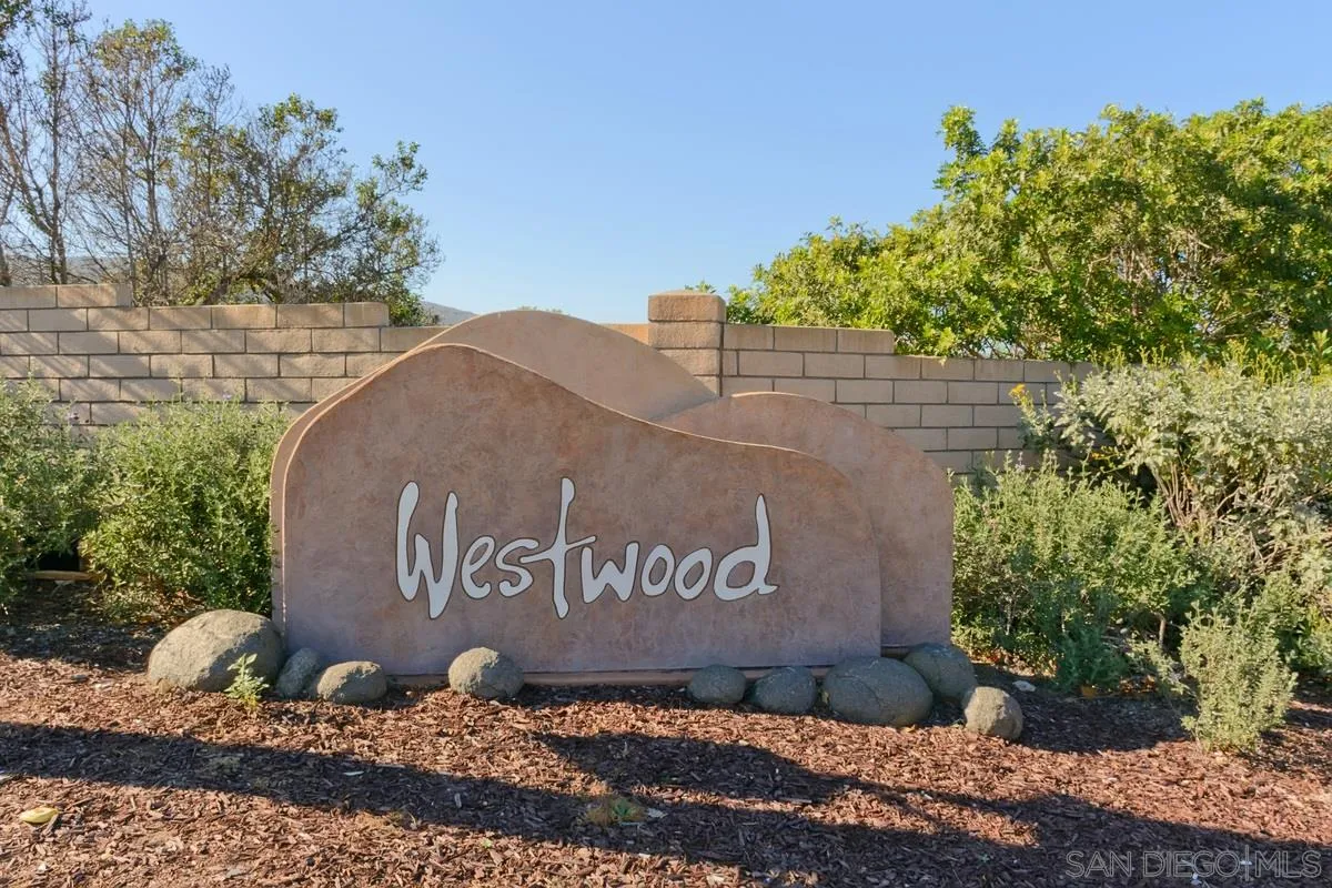 11068 Pinzon Way San Diego, CA 92127 - Photo 27 of 31 a sign that is sitting on a brick wall