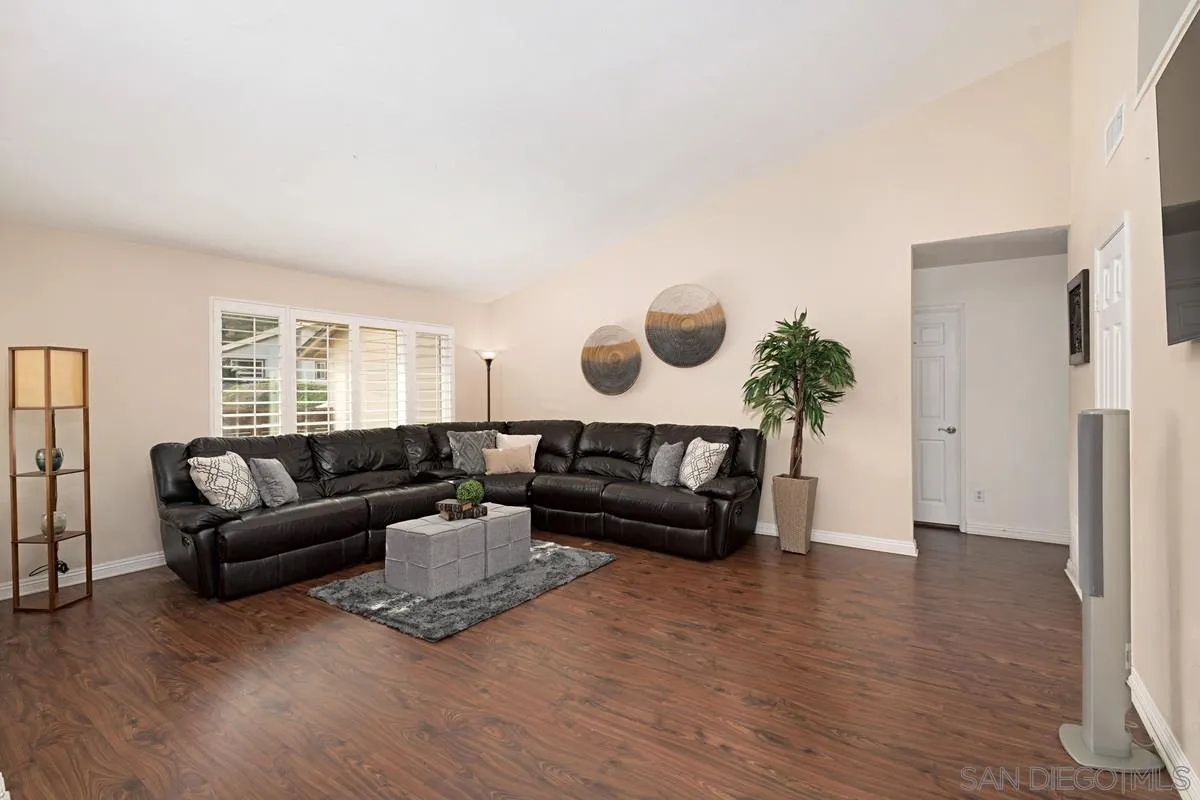 11068 Pinzon Way San Diego, CA 92127 - Photo 8 of 31 a living room with furniture and a wooden floor