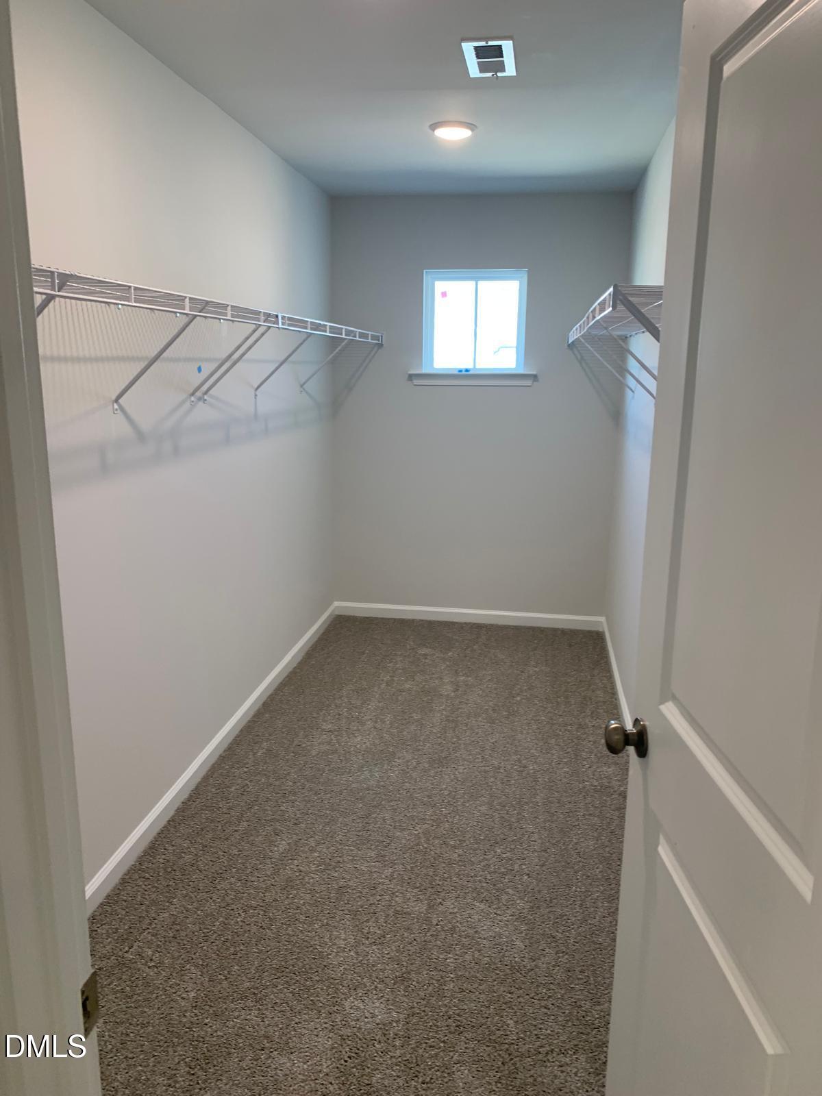 233 Broomside Avenue Raleigh, NC 27603 - Photo 18 of 18 a view of a room with rack on the wall