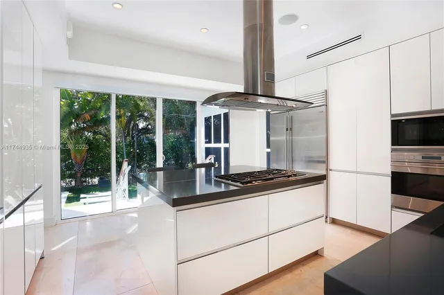 a view of a livingroom with wooden floor and fence