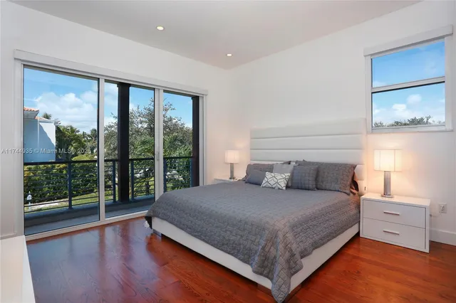 a front view of a house with a yard and a garage