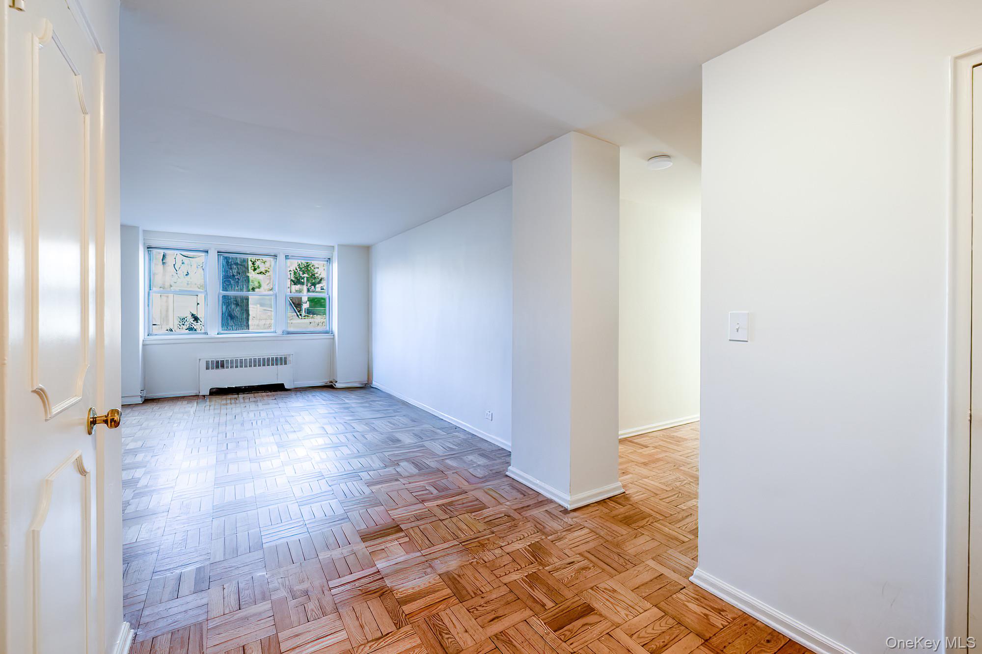 55 Knolls Crescent, Unit 2D Bronx, NY 10463 - Photo 4 of 24 a view of an empty room with a window