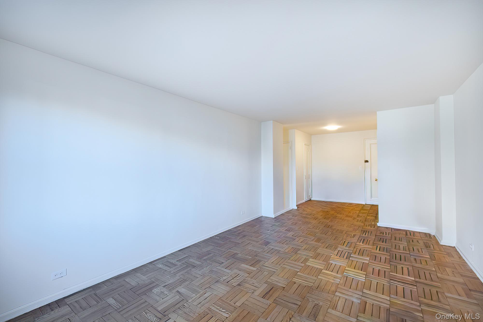 55 Knolls Crescent, Unit 2D Bronx, NY 10463 - Photo 6 of 24 a view of a big room with closet and cabinet