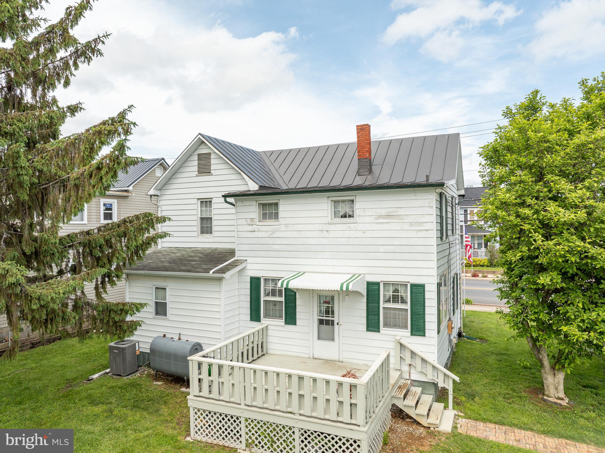 101 North Mildred Street Ranson, WV 25438 - Photo 60 of 75 a view of a house with a chairs in a patio