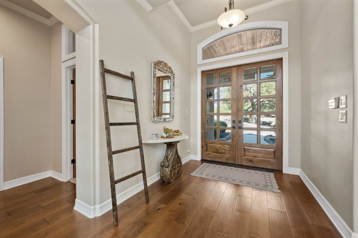 185 Shimmering Shore Court Spring Branch, TX 78070 - Photo 15 of 40 a view of a hallway with wooden floor and dining room