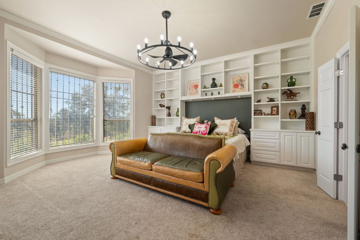 185 Shimmering Shore Court Spring Branch, TX 78070 - Photo 16 of 40 a living room with furniture and a chandelier