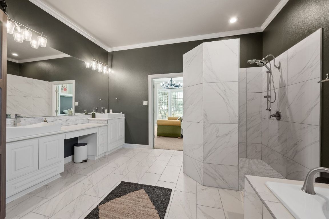 185 Shimmering Shore Court Spring Branch, TX 78070 - Photo 21 of 40 a spacious bathroom with a double vanity sink a mirror and shower