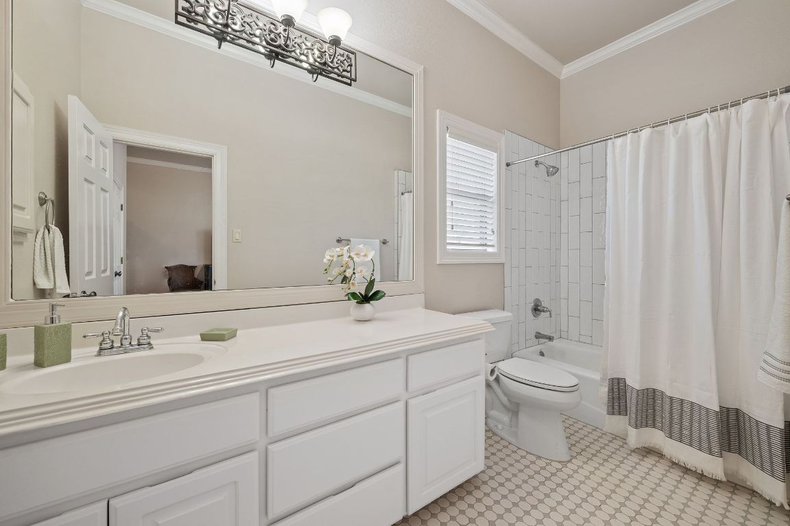 185 Shimmering Shore Court Spring Branch, TX 78070 - Photo 23 of 40 a bathroom with a toilet sink and mirror