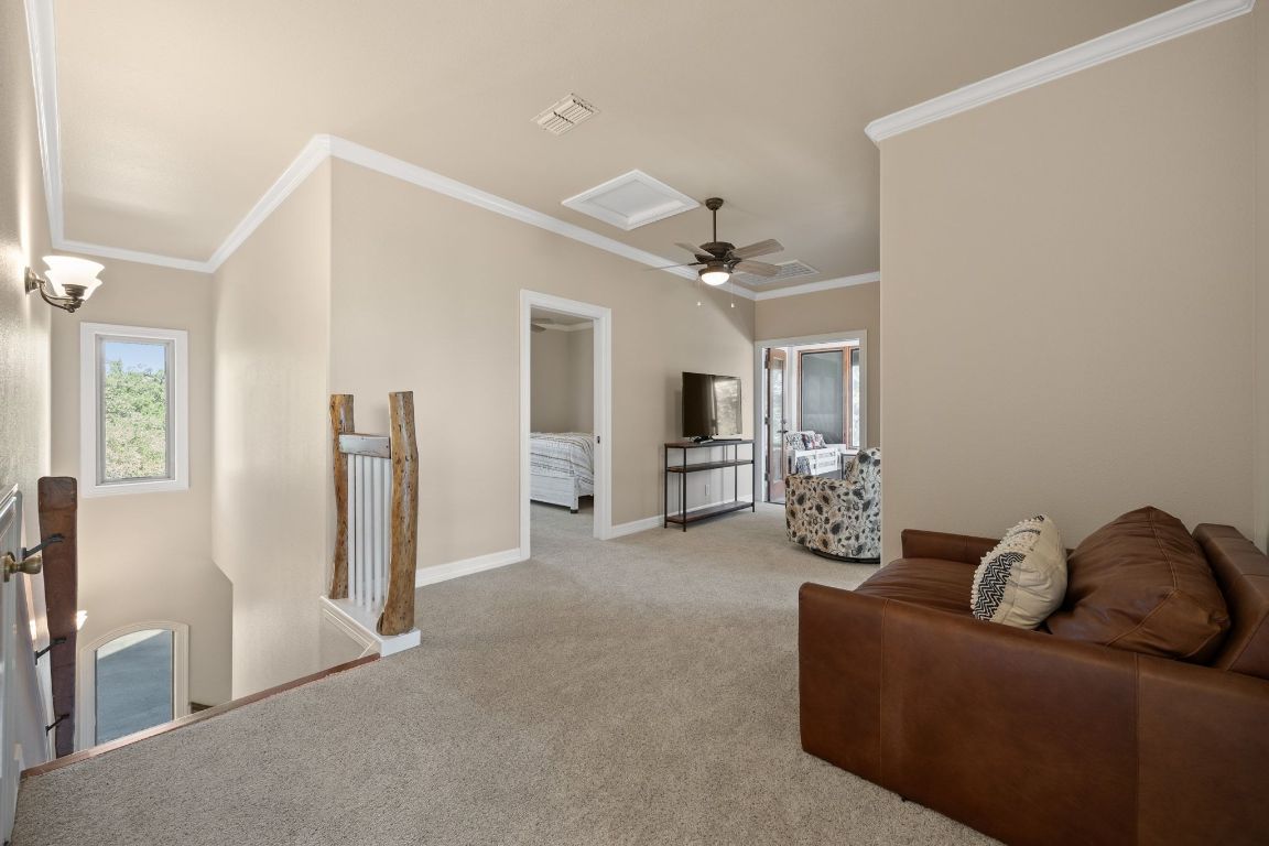 185 Shimmering Shore Court Spring Branch, TX 78070 - Photo 25 of 40 a living room with furniture and a ceiling fan