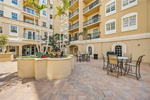 a view of a building and a couple of people seating
