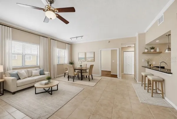a living room with furniture and a large window