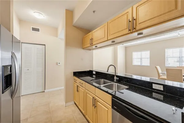 a kitchen that has a sink and cabinets