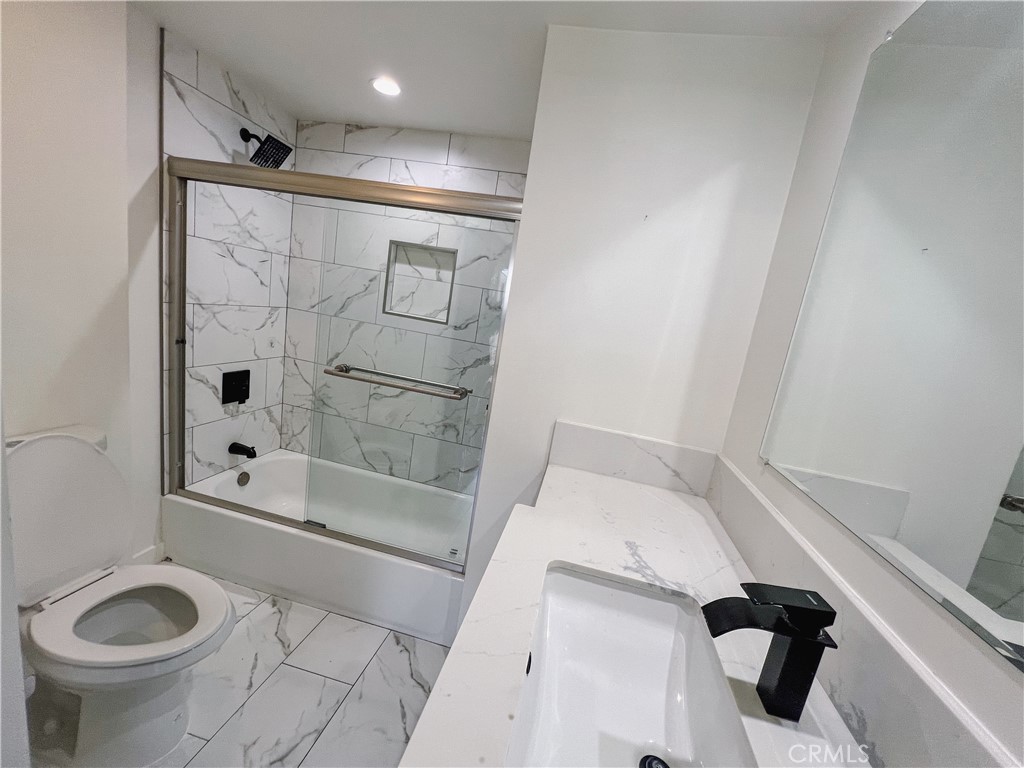 1245 West Cienega Avenue San Dimas, CA 91773 - Photo 7 of 14 a bathroom with a shower and a toilet