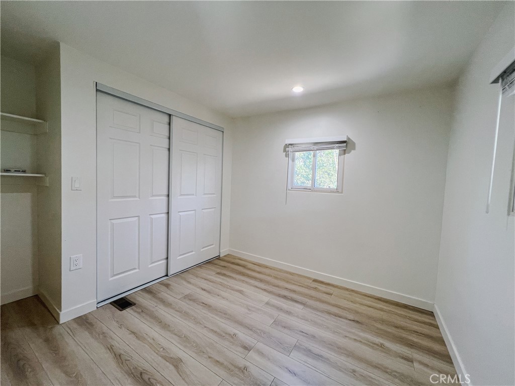1245 West Cienega Avenue San Dimas, CA 91773 - Photo 10 of 14 a view of an empty room with wooden floor