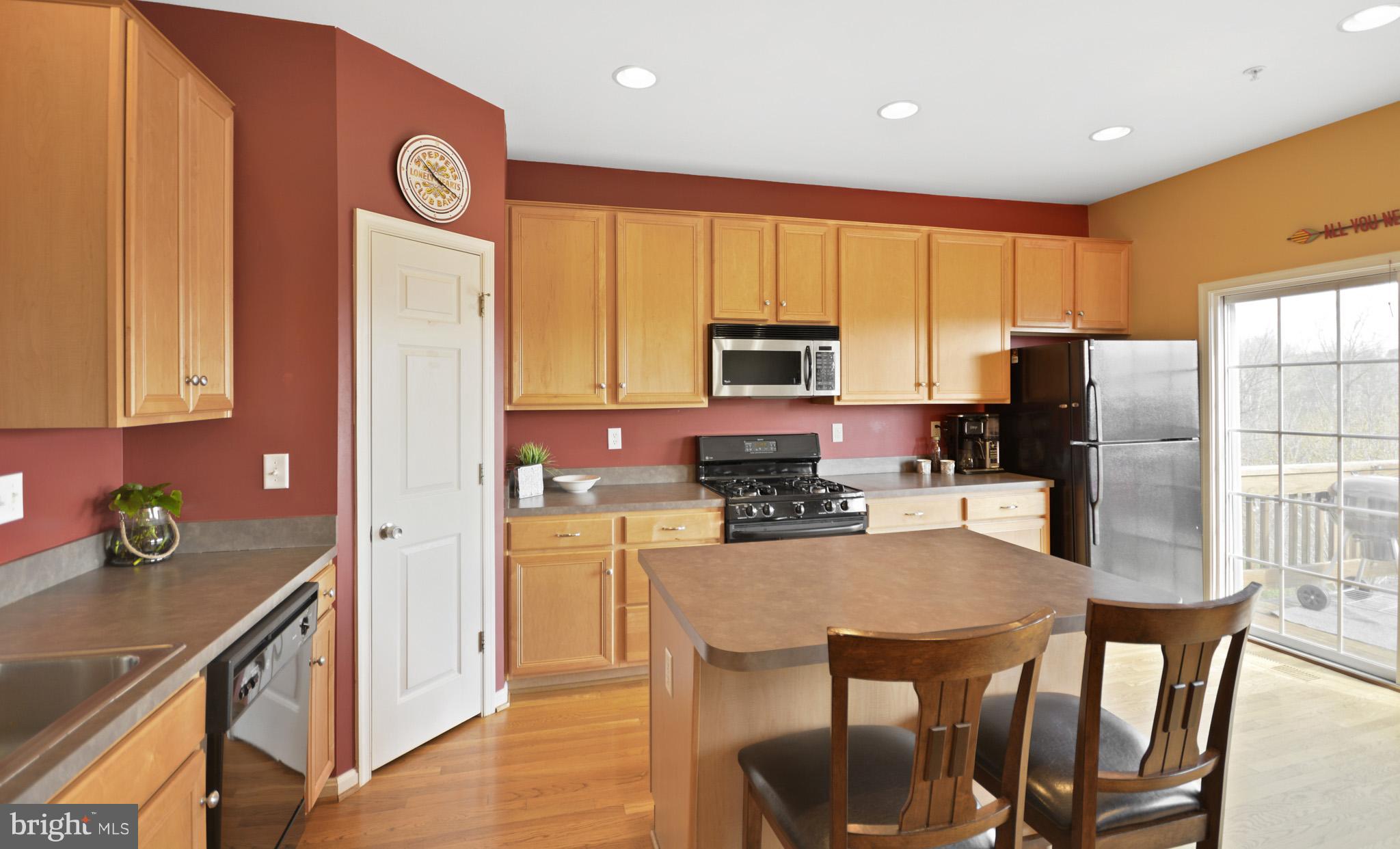 1741 Trestle Street Mount Airy, MD 21771 - Photo 13 of 30 a kitchen with stainless steel appliances granite countertop a refrigerator a stove top oven a sink and dishwasher