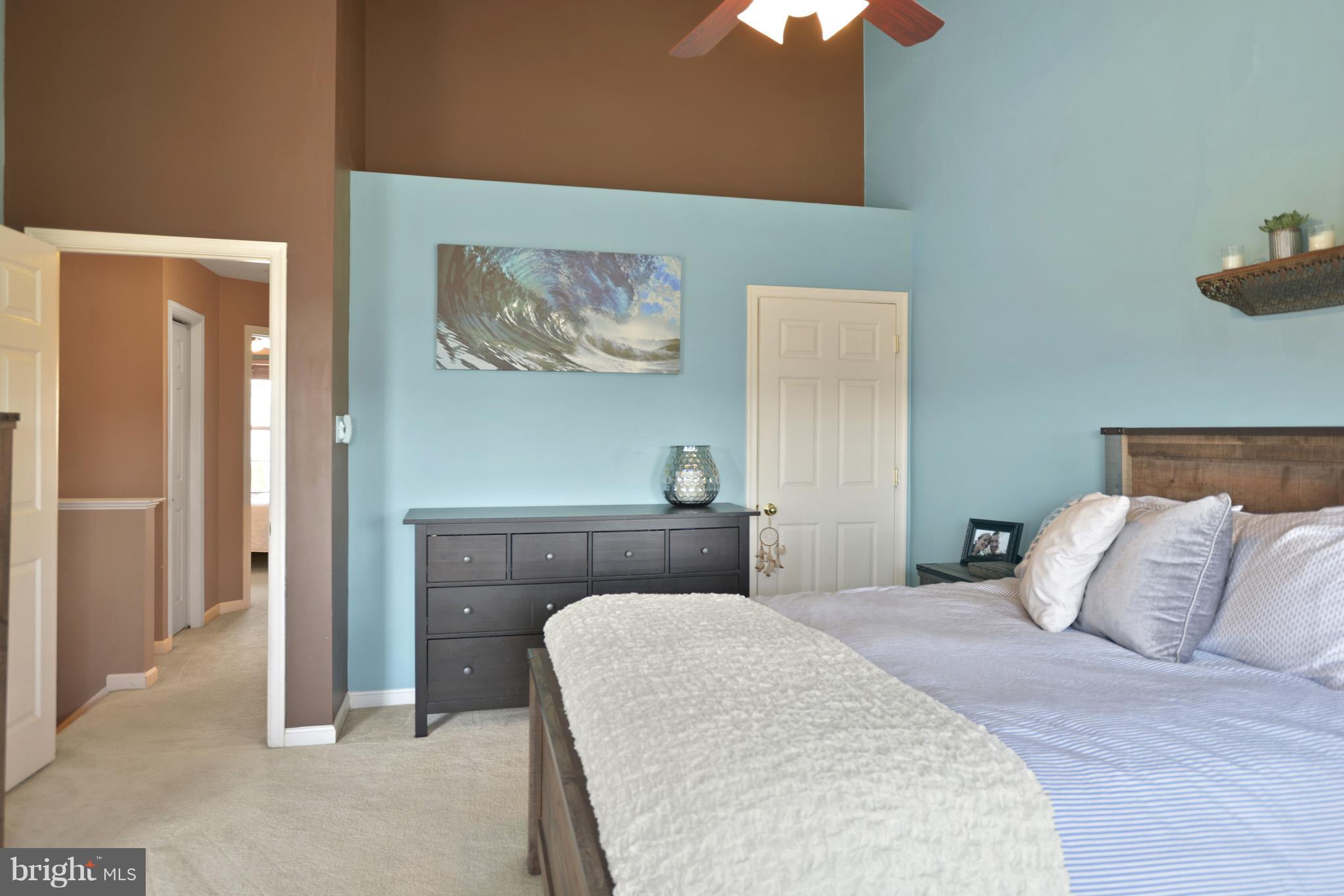 1741 Trestle Street Mount Airy, MD 21771 - Photo 17 of 30 a bedroom with a bed and a chandelier
