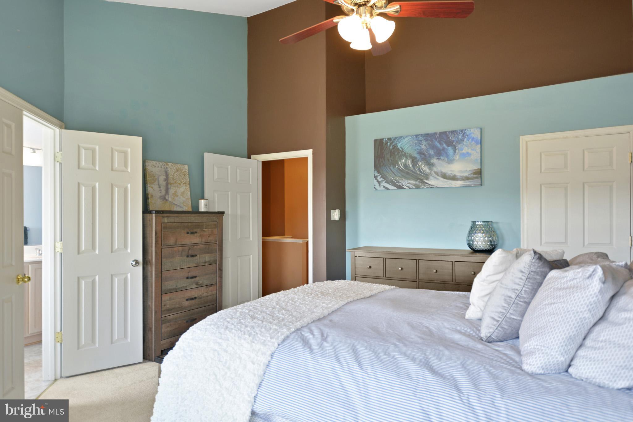 1741 Trestle Street Mount Airy, MD 21771 - Photo 18 of 30 a bedroom with a bed and a chandelier